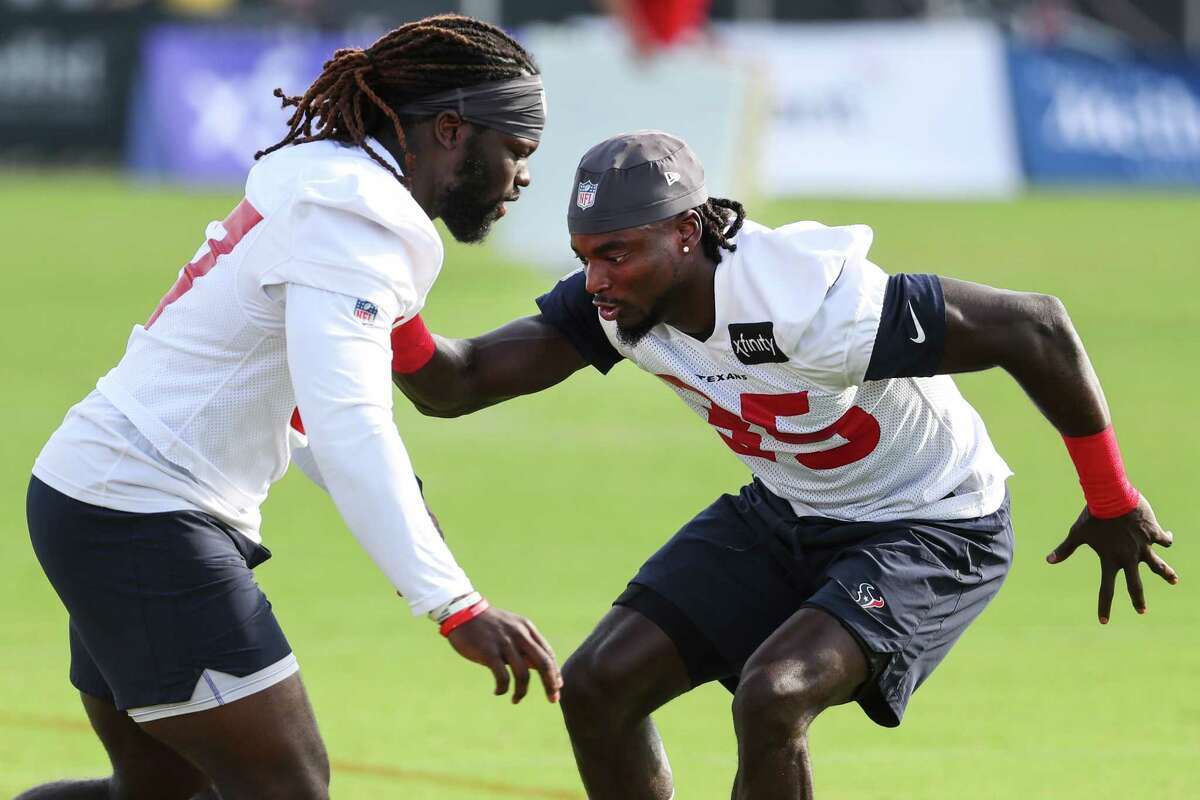 Houston Texans defensive backs Tavierre Thomas (37) and Keion Crossen (35) run pass coverage drills during an NFL training camp football practice Monday, Aug. 2, 2021, in Houston.