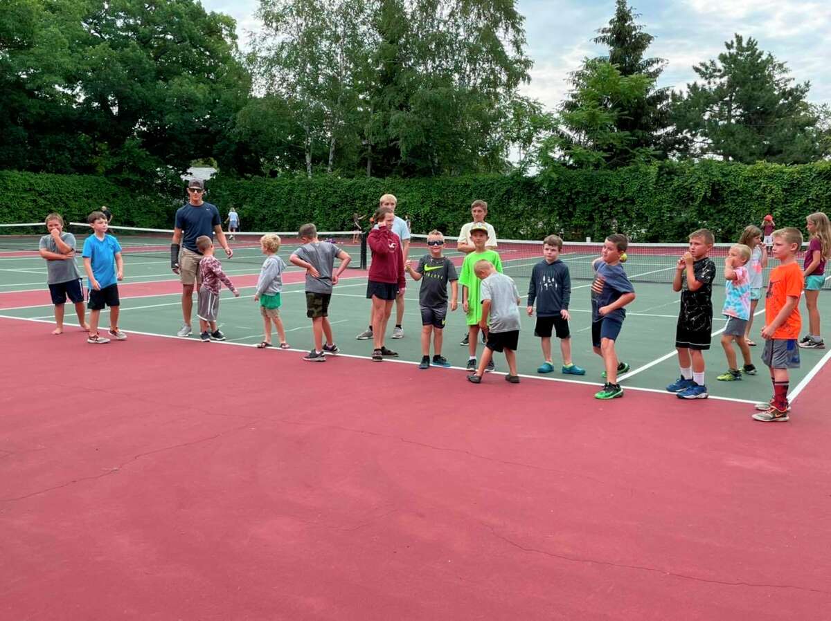 Kids and volunteers get ready for activities at the tennis courts at Port Austin Village Park. (Port Austin Summer Parks and Rec/Courtesy Photo)