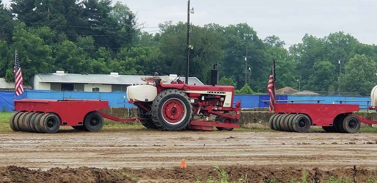 The West Michigan Pullers were at the Eaton County Fair in Charlotte in July. The group will host a tractor pull event starting at 7 p.m. on Aug. 20 in the grand stands at the Manistee County Fairgrounds in Onekama. (Courtesy photo)