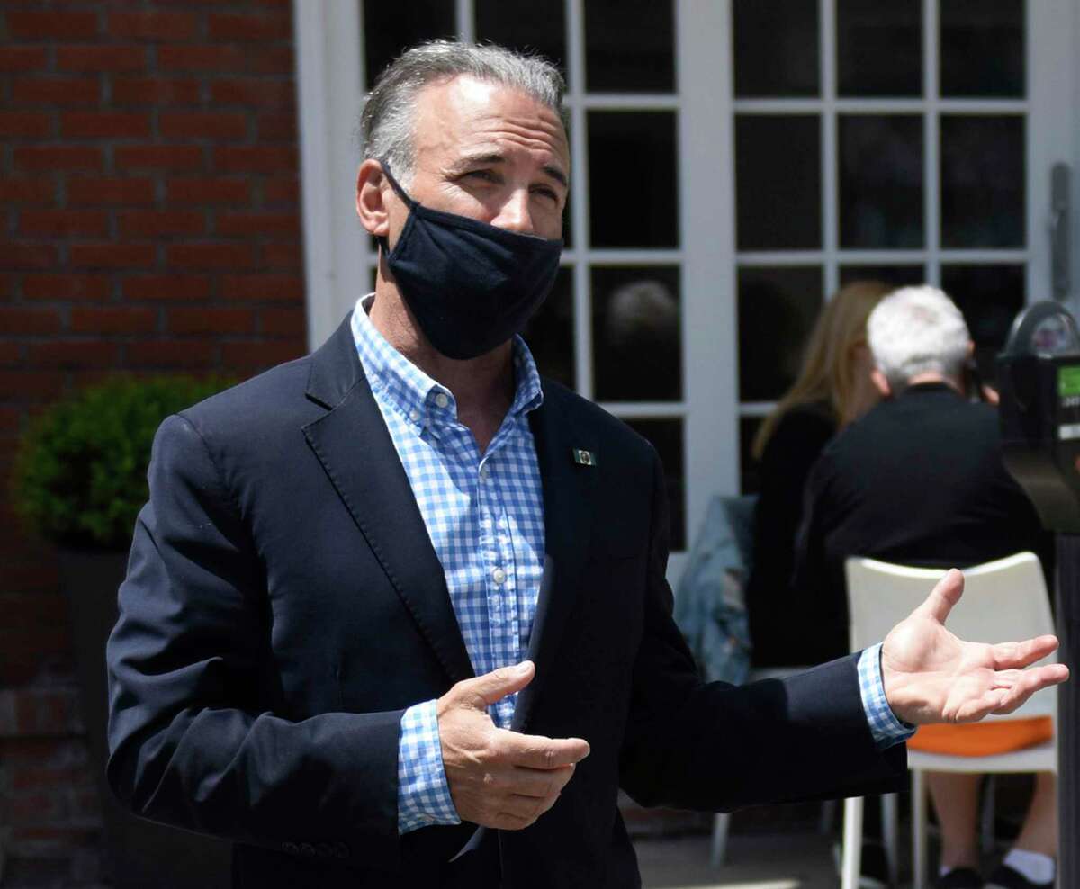 Greenwich First Selectman Fred Camillo tours outdoor dining space last June. He has put back in place a mask requirement for town buildings but, as they wait for guidance from the governor, will let restaurants and other businesses put their own policies in place.