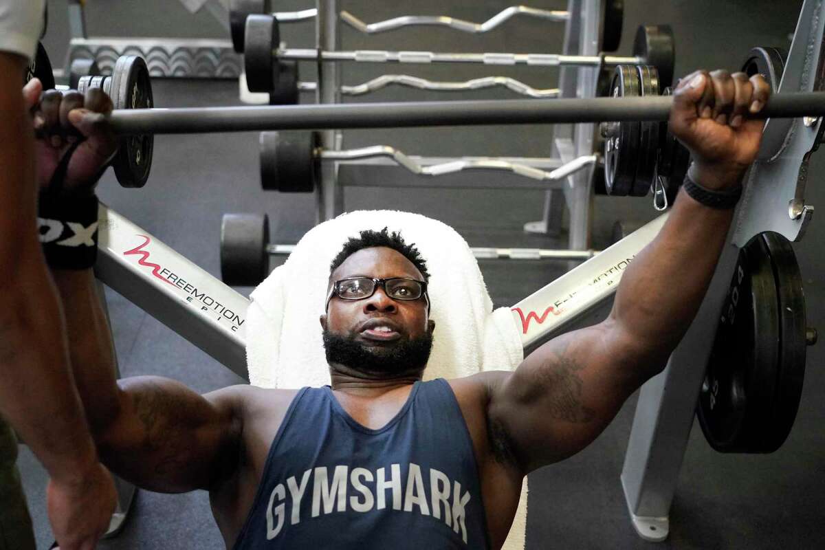 Kel Mabatah works out at Club Westside , 1200 Wilcrest Dr., Saturday, July 24, 2021 in Houston as he prepares for a bodybuilding competition. In Dec. 2014, he was brutal assaulted in Nigeria, where he was helping run his family’s business. He suffered traumatic brain injury, was partial paralyzed, and could not speak.