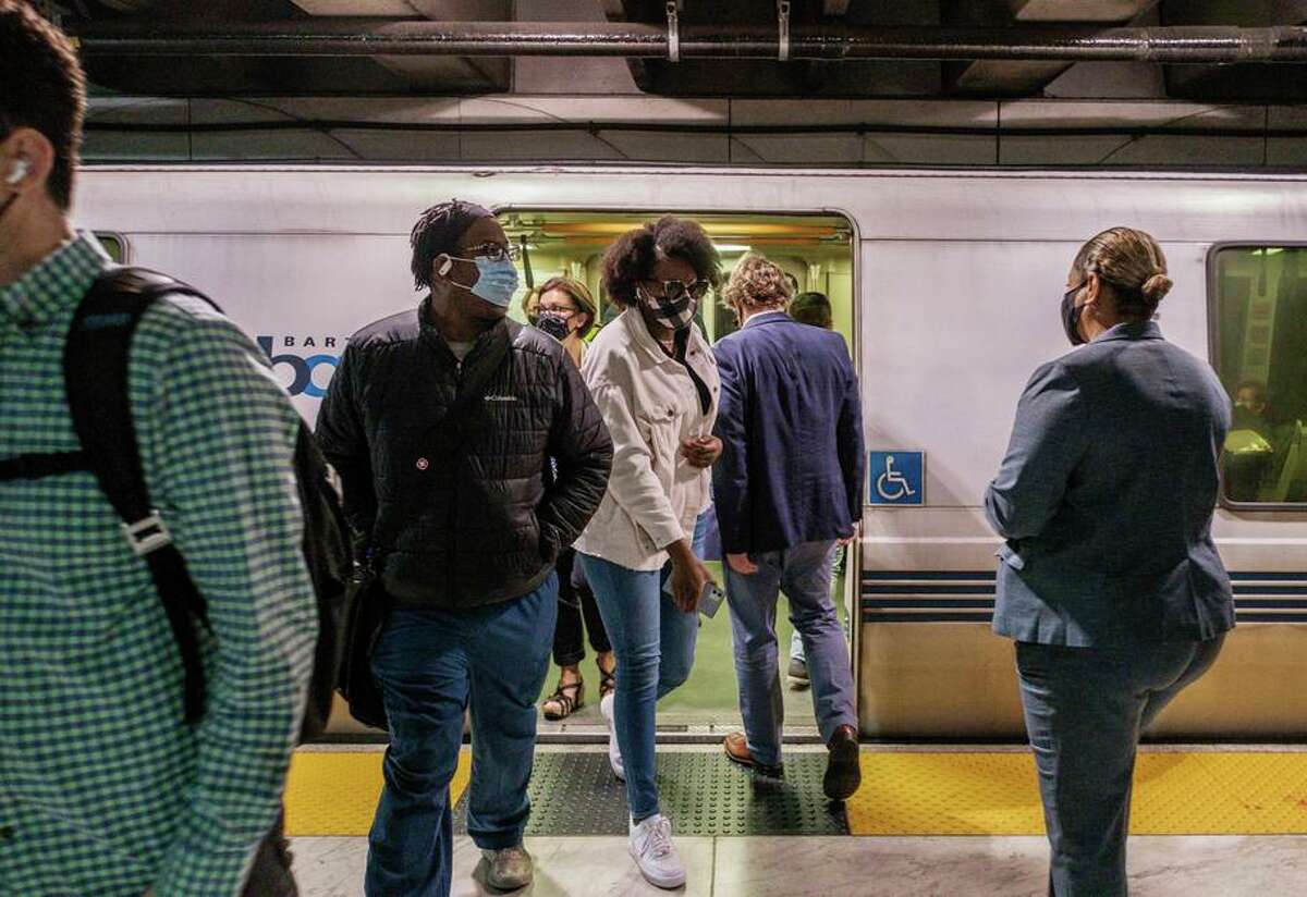 BART GM Bob Powers is seen entering a BART train with other riders in San Francisco on Monday.