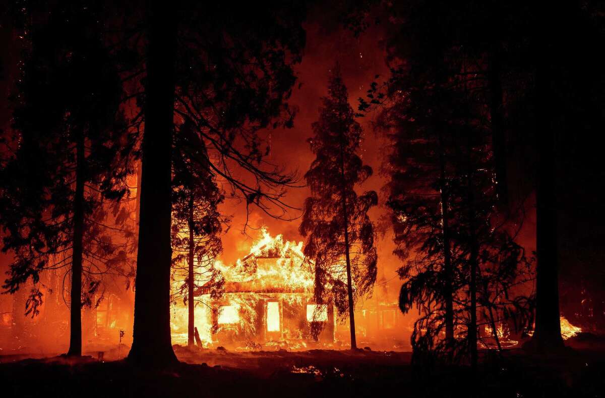 A home burns as the Dixie Fire tears through the Indian Falls neighborhood of unincorporated Plumas County on July 24.
