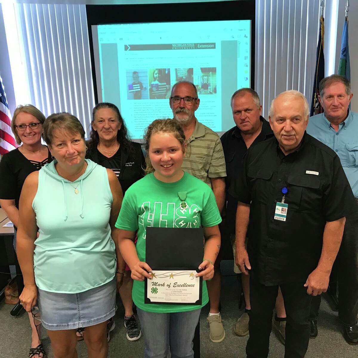 Lily Putkela, 12, winner of the 4-H Mark of Excellence Award for Lake County, meets with the Lake County Board of Commissioners to present her essay on what 4-H means to her. Lily is one of 20 youths throughout the state honored with this 4-H award. (Courtesy/Lake County 4-H)