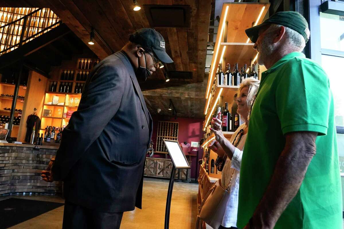 Security personnel ask customers for proof of vaccination as they enter City Winery on June 24, 2021, in New York. 