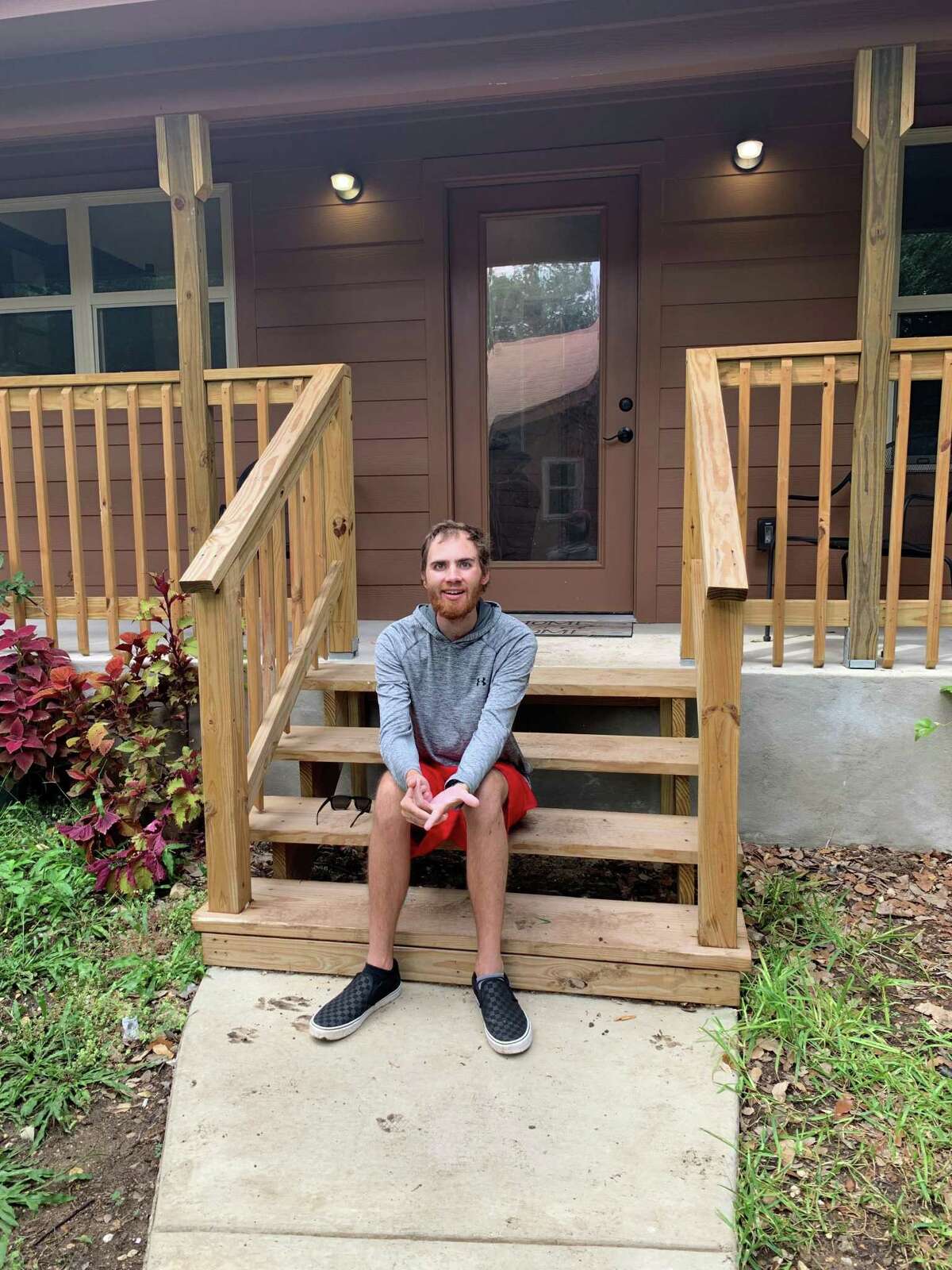 Shane Matowitz sits on the steps of his casita in his parents backyard in Braun Station East. After suffering a traumatic brain injury in a car accident in 2017, Shane’s parents built the casita so he’d have a place of his own to live.