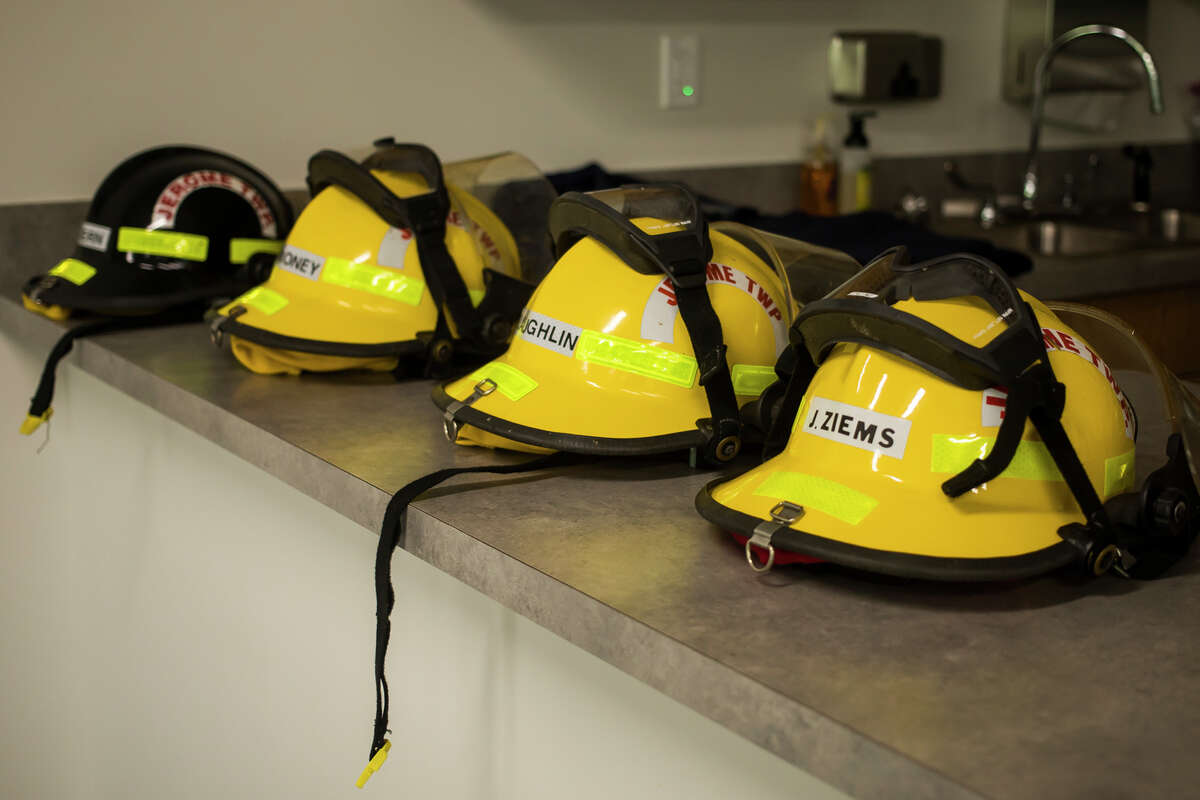 In this file photo, helmets are ready to be presented to John Ziems, Corey McLaughlin and Jackson Carmoney, in honor of the completion of their training through the Jerome Township Fire Academy, Monday, Aug. 2, 2021 at the Jerome Township Fire Department in Sanford. (Katy Kildee/kkildee@mdn.net)