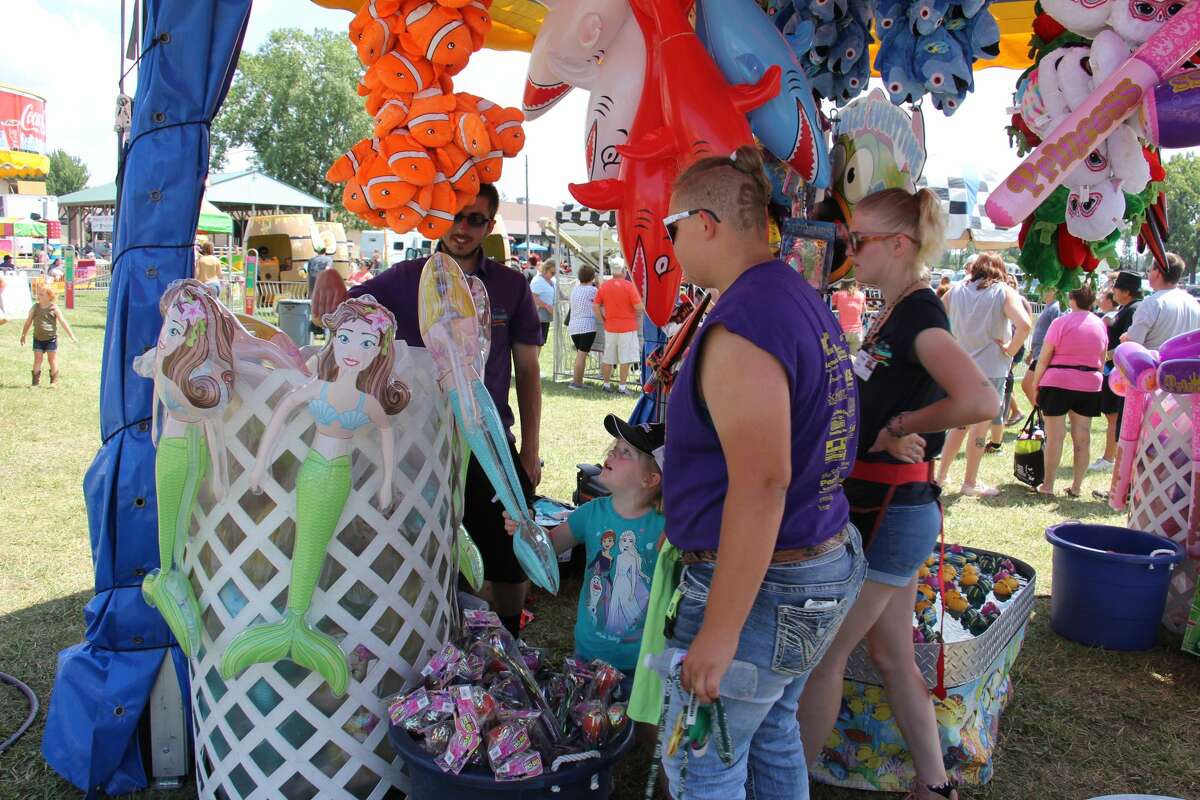 The 2021 Huron Community Fair continued on Tuesday in high spirits with the pig show, animal exhibits and the midway, which drew hundreds of families and kids to enjoy the rides.