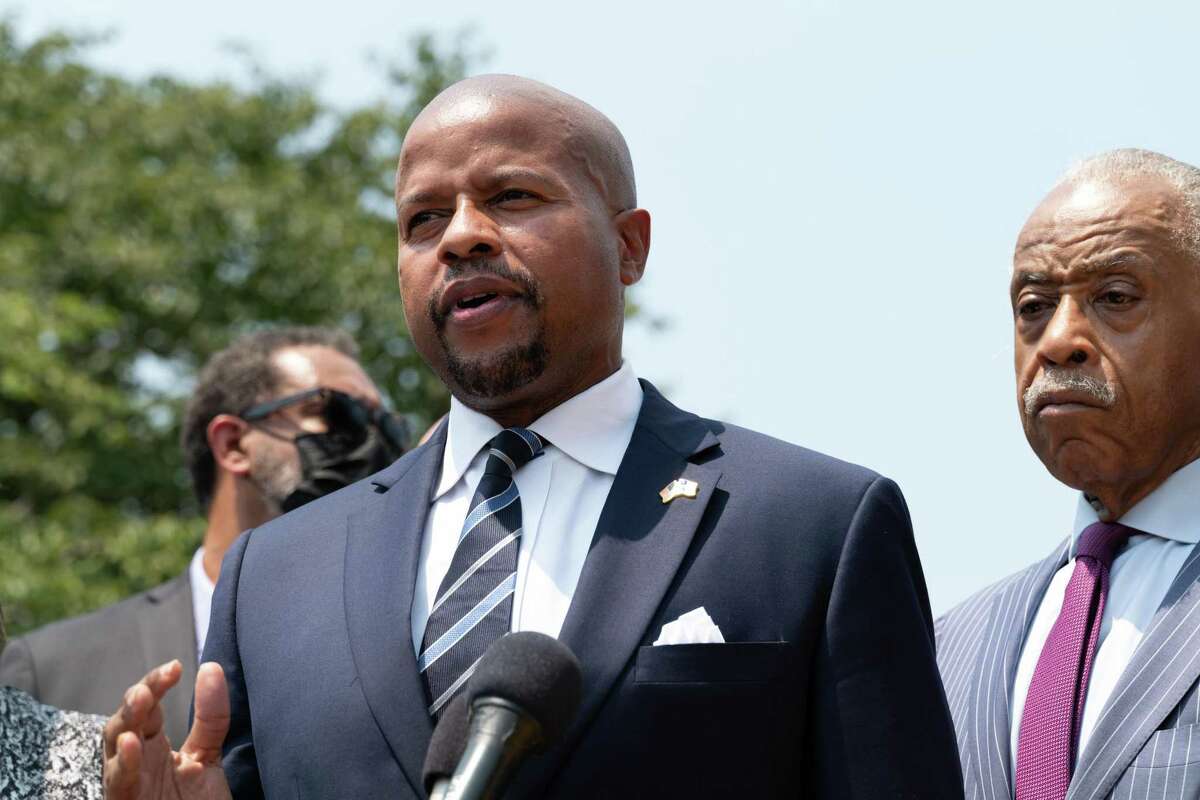 Ron Reynolds, a Texas Legislative Black Caucus member, speaks, with Rev. Al Sharpton, (R) behind him, at a press conference at the Martin Luther King, Jr. Memorial on July 28, 2021 in Washington, DC. (Photo by Cheriss May/Getty Images)
