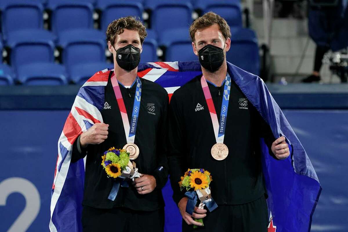 Bronze medalists Michael Venus and Marcus Daniell, of New Zealand, pose with their medals during a ceremony for the men's doubles tennis competition at the 2020 Summer Olympics, Friday, July 30, 2021, in Tokyo, Japan. Daniell practiced in Salisbury, Conn. during the pandemic.