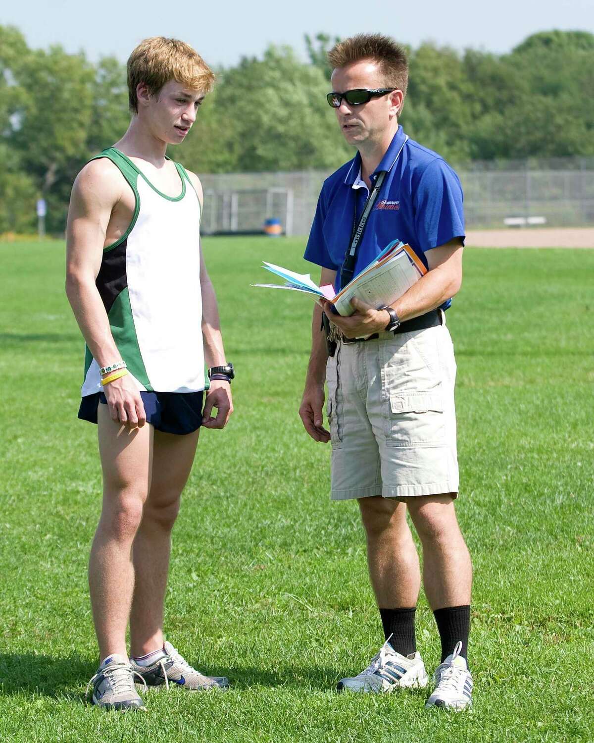 Danbury High's Alex Levine has a pre-practice chat with coach Rob Murray Thursday at Danbury High.