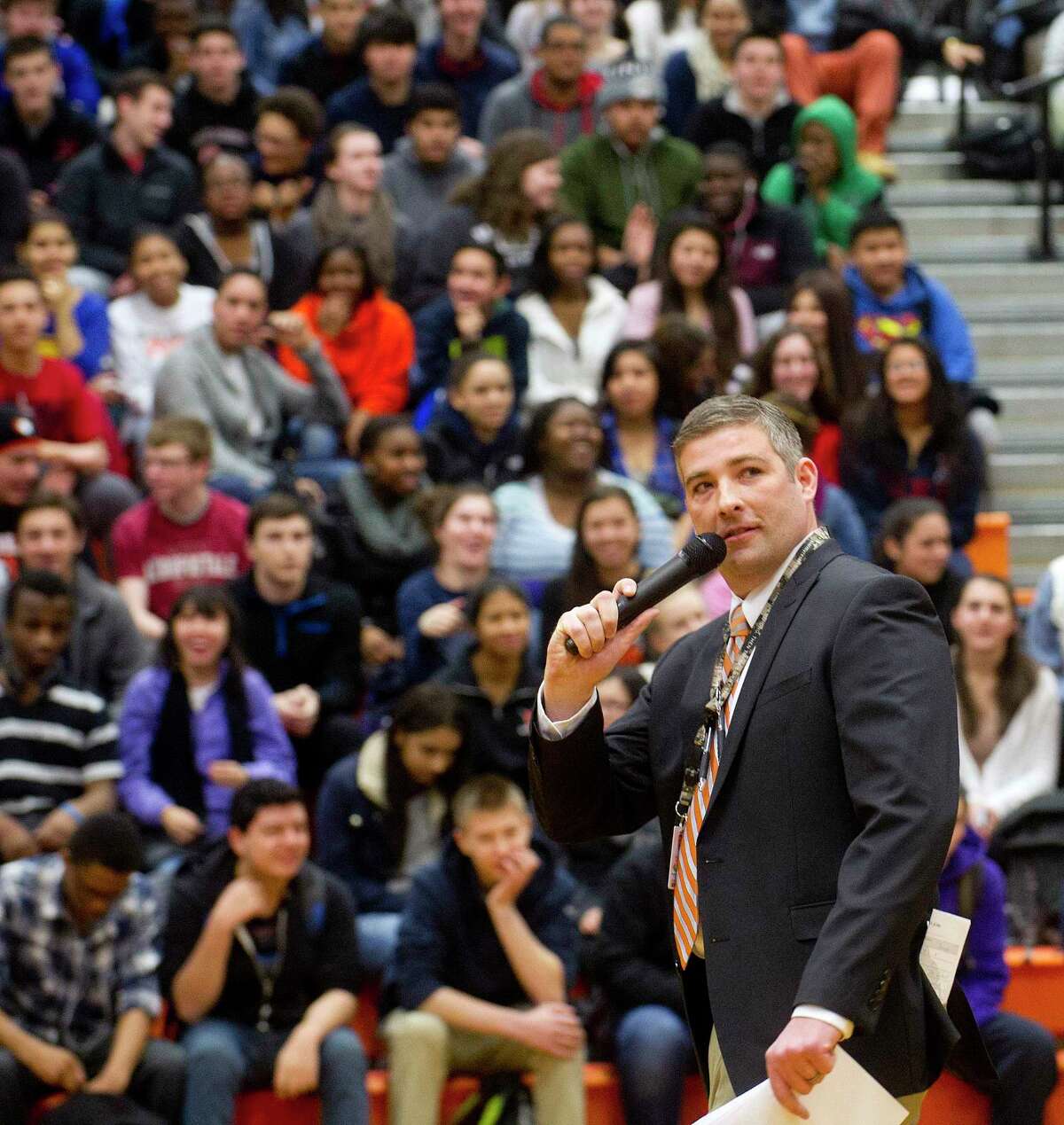 Then-assistant principal Matthew Forker speaks during an assembly aimed to increase school pride on Friday, February 20, 2015.