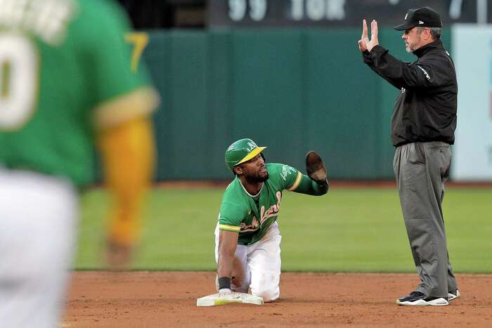 A's outfielder Ramón Laureano delivers bat in-game to young fan at Fenway