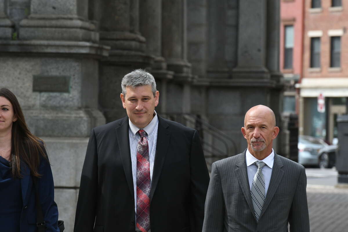 Former MyPayrollHR CEO Michael Mann, center, walking into U.S. District Court in Albany earlier this year with his attorneys to be sentenced in the $101 million fraud case that brought down his company and led to tens of millions of dollars in losses for Pioneer Bank. (Will Waldron)