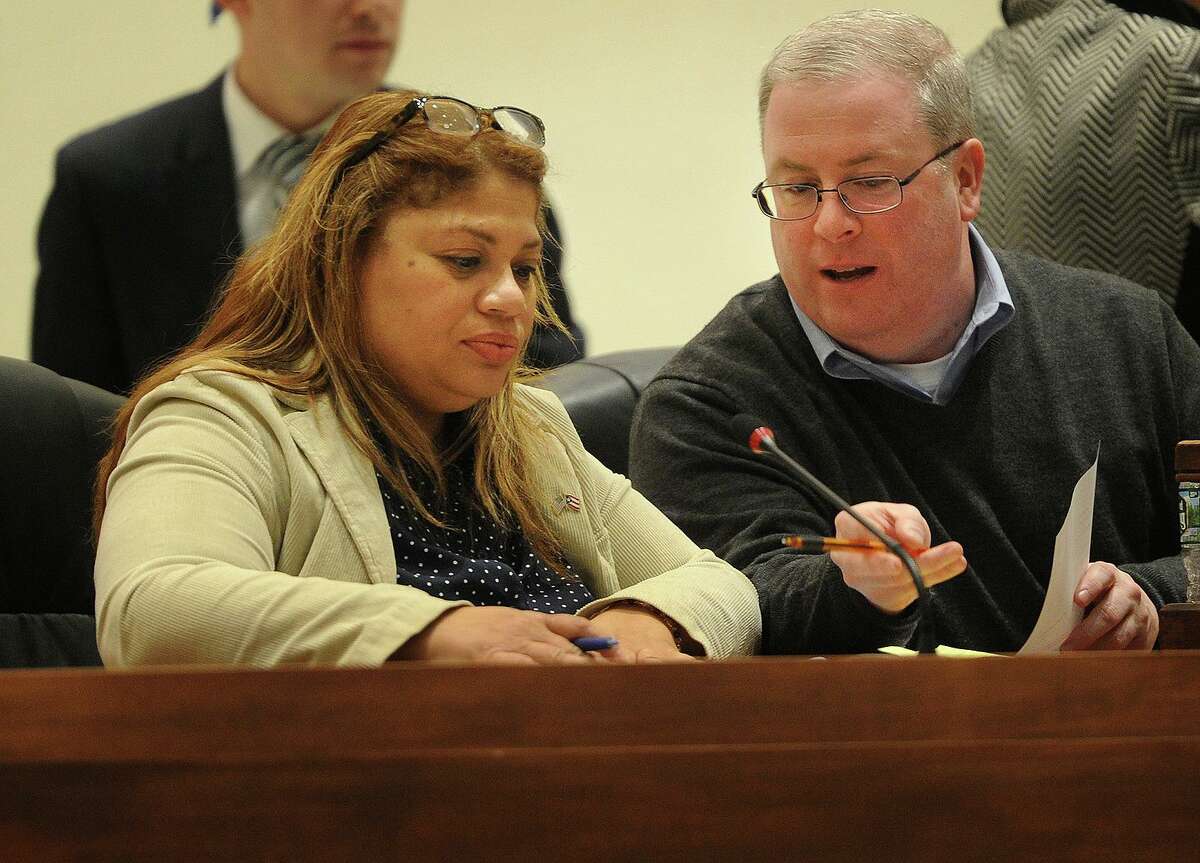 Newly-elected Bridgeport City Coucil President Aidee Nieves sits with outgoing Council President Thomas McCarthy during the City Council meeting at City Hall in Bridgeport, Conn. on Monday, December 4, 2017.