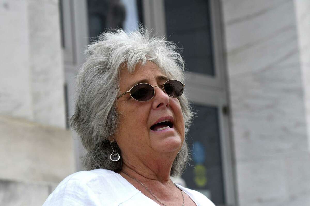 Bonnie Rosengrant, a victim of Michael Mann's $100 million bank fraud scheme that led to the collapse of his payroll company, MyPayrollHR, speaks to reporters outside James T. Foley U.S. Courthouse following Mann'ss sentencing on Wednesday, Aug. 4, 2021, in Albany N.Y. Rosengrant is the owner of the Hometown Diner in Rindge, N.H. A new report by the state Department of Financial Services found that a lot more has to be done to regulate payroll services companies in New York.