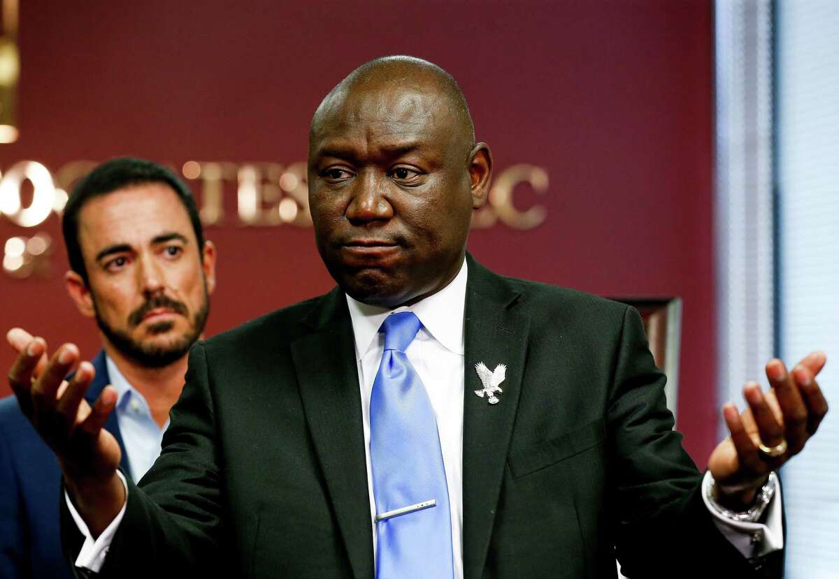 Attorney Ben Crump, right, talks to reporters about a lawsuit filed against Harris County in the death of Caitlynne Infinger Guajardo - whose family says she was murdered by her husband while he was out on multiple personal recognizance bonds in 2019 - during a press conference on Wednesday, Aug. 4, 2021, in Houston.