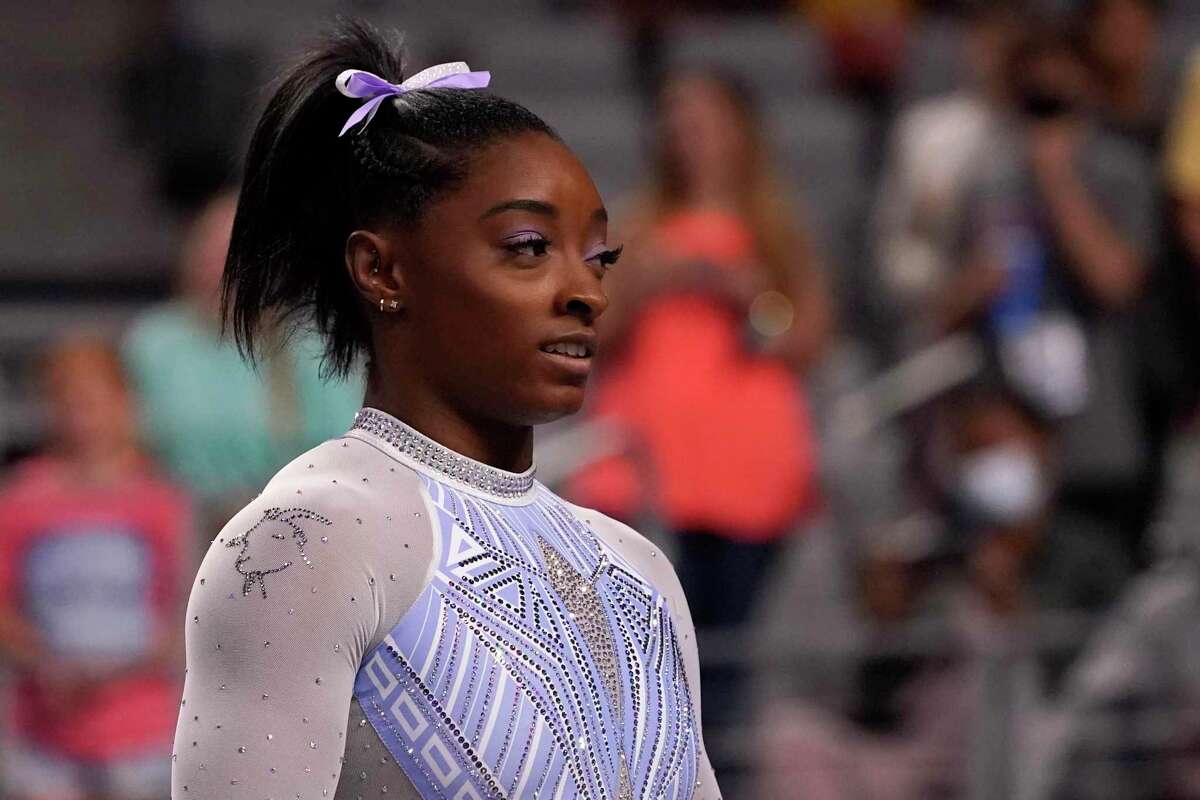 Simone Biles waits her turn to compete on the balance beam during the U.S. Gymnastics Championships in Fort Worth, Texas, June 4, 2021. Biles wore a goat laced into her leotard during the competition.