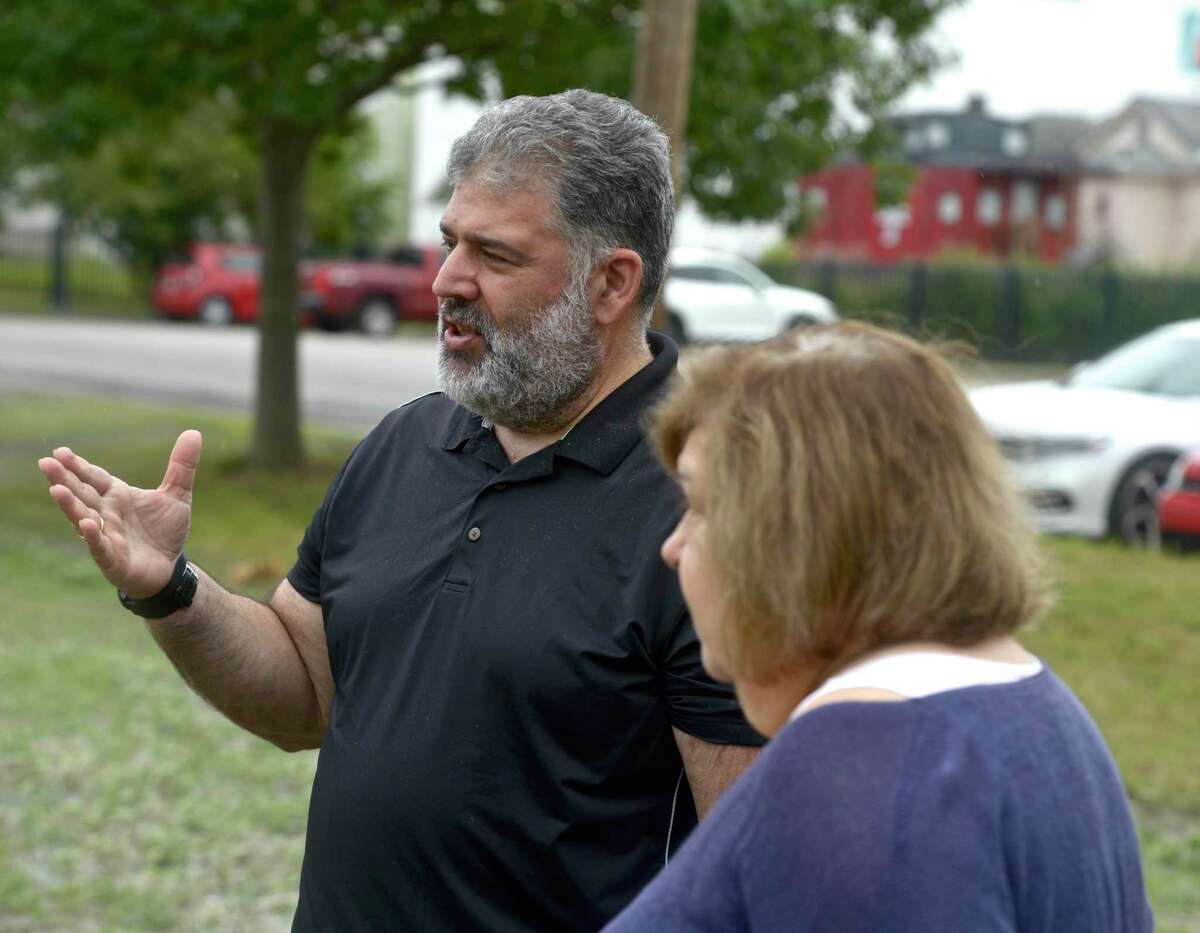 Mayor Pete Bass and former mayor Liba Furhman talk about the new plans for the River Walk area in New Milford that were just approved. Thursday, July 1, 2021, in New Milford, Conn. Town Council has proposed an $18,000 raise for the mayor.