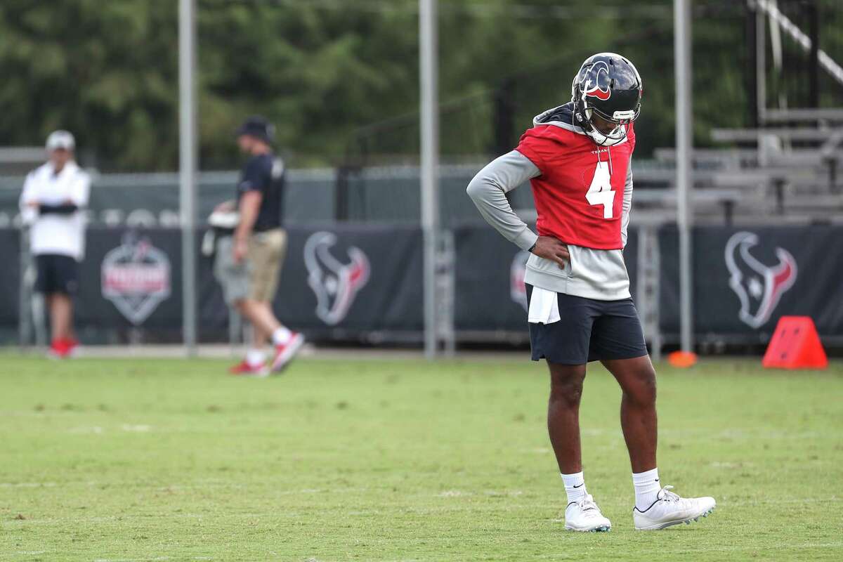 Houston Texans quarterback Deshaun Watson stands on the field during an NFL training camp football practice Thursday, July 29, 2021, in Houston.