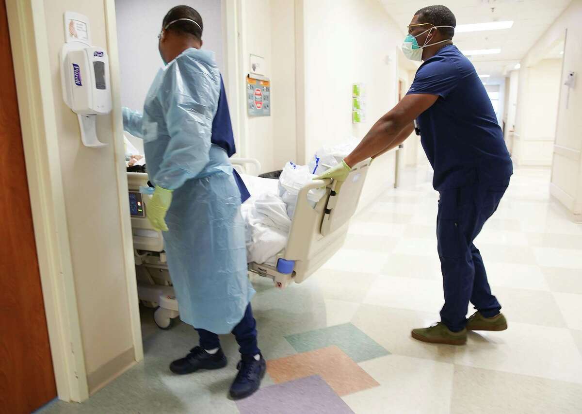 A patient is transferred to another floor at Houston Methodist Continuing Care Hospital in Katy on Tuesday, Aug. 3, 2021.