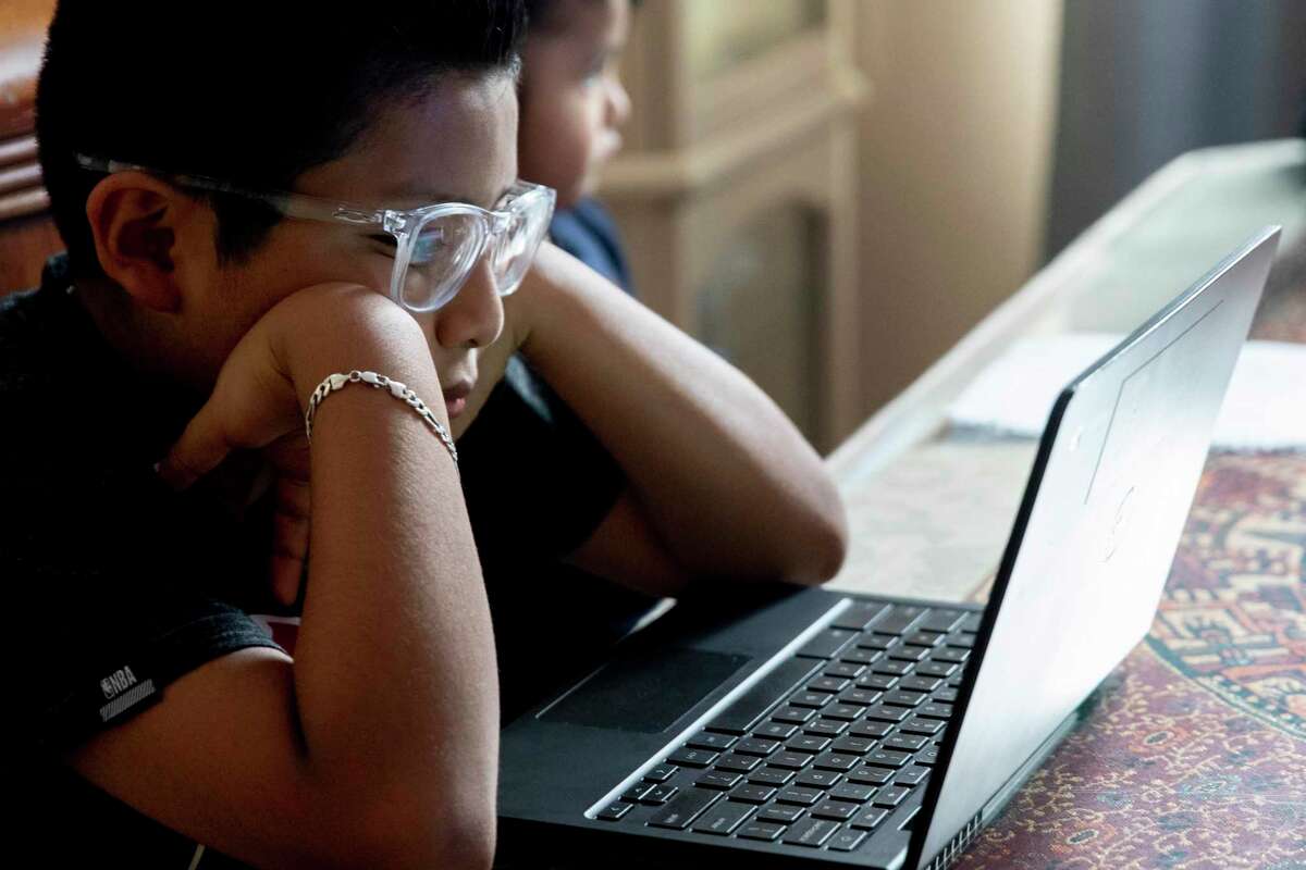 A student in California does school work last year. No student’s potential should be limited because their family cannot afford internet access.