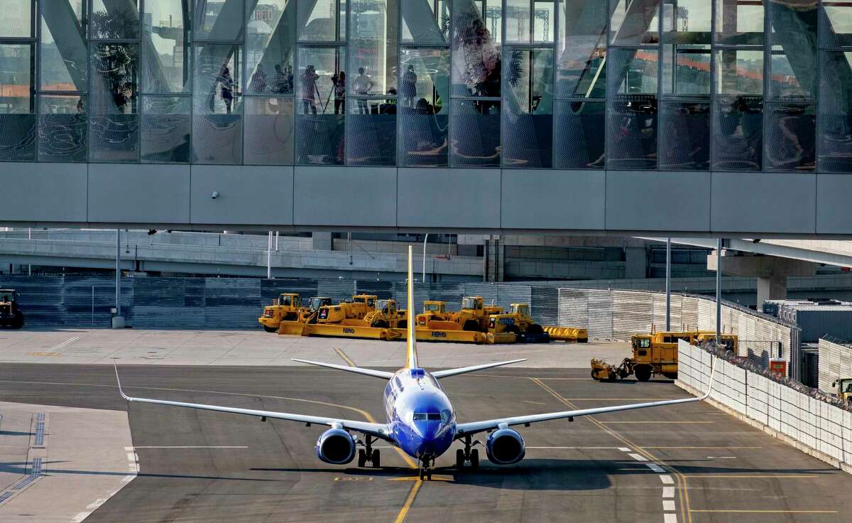 A Southwest jet moves at LaGuardia Airport in May 2021 in New York City. Despite a rebound in travel this spring, Booking Holdings absorbed another quarterly loss from its travel websites that include Booking.com, Kayak and Priceline. (AP Photo/Craig Ruttle)
