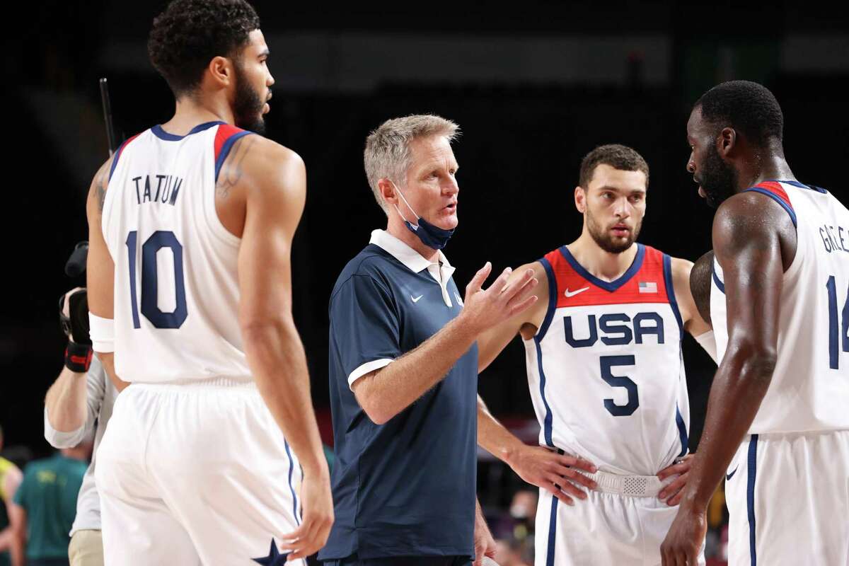 SAITAMA, JAPAN - AUGUST 05: Team United States Assistant Coach Steve Kerr speaks with Draymond Green #14 during the second half of a Men's Basketball quarterfinals game on day thirteen of the Tokyo 2020 Olympic Games at Saitama Super Arena on August 05, 2021 in Saitama, Japan. (Photo by Gregory Shamus/Getty Images)