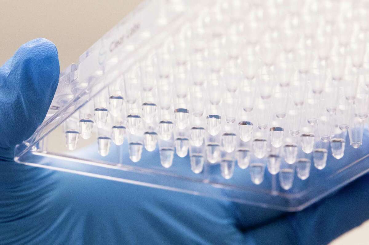 Lab technician Aamina Zahid prepares diluted samples of COVID-19 before running them through the state-of-the-art Clear Lab genomic sequencer while inside the Contra Costa County Public Health Lab at the Contra Costa Regional Medical Center in Martinez, Calif. Thursday, May 27, 2021.