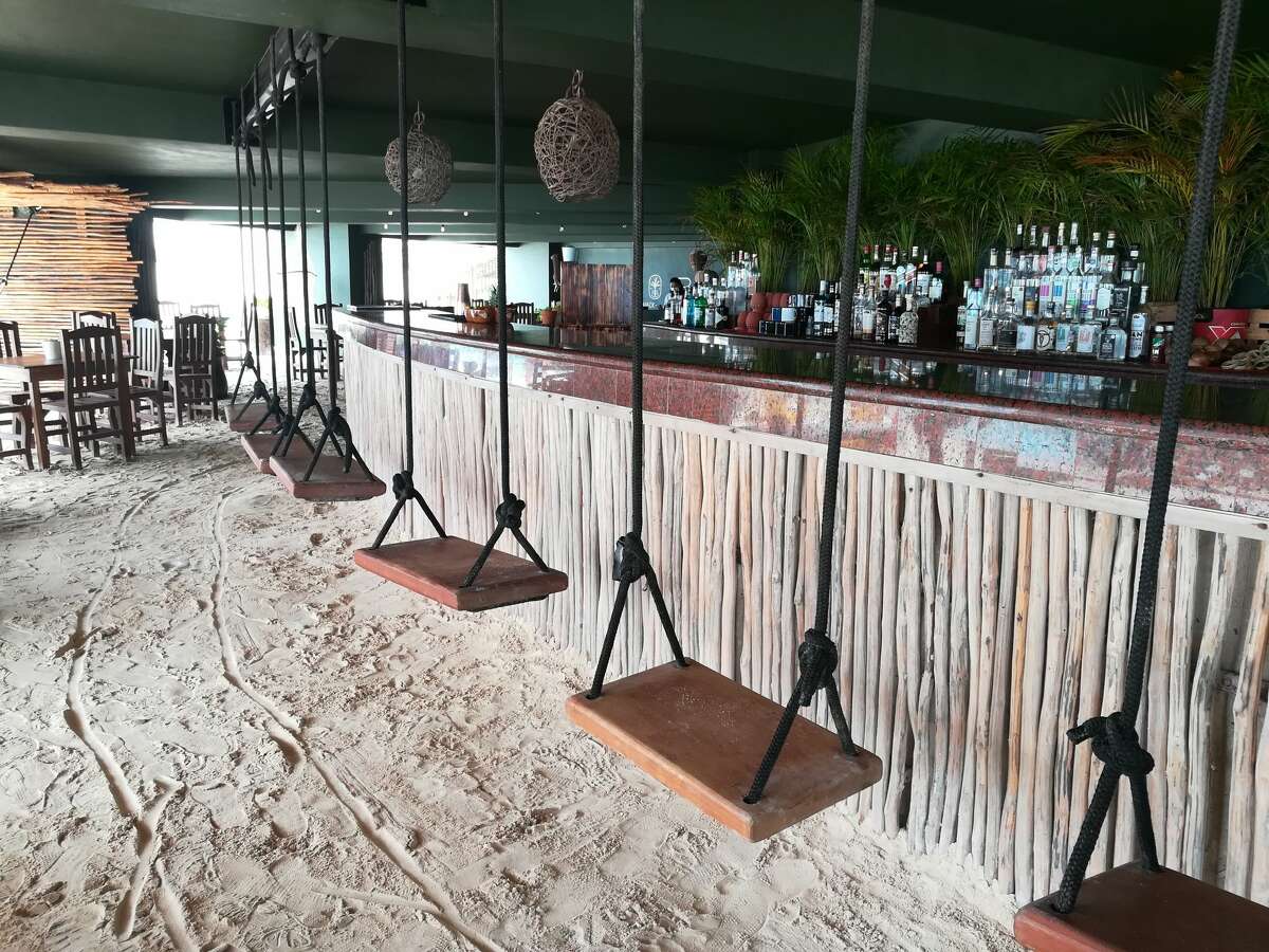 Swingset seating at SacBé Beach Shack , Marriott Cancun Resort, Mexico