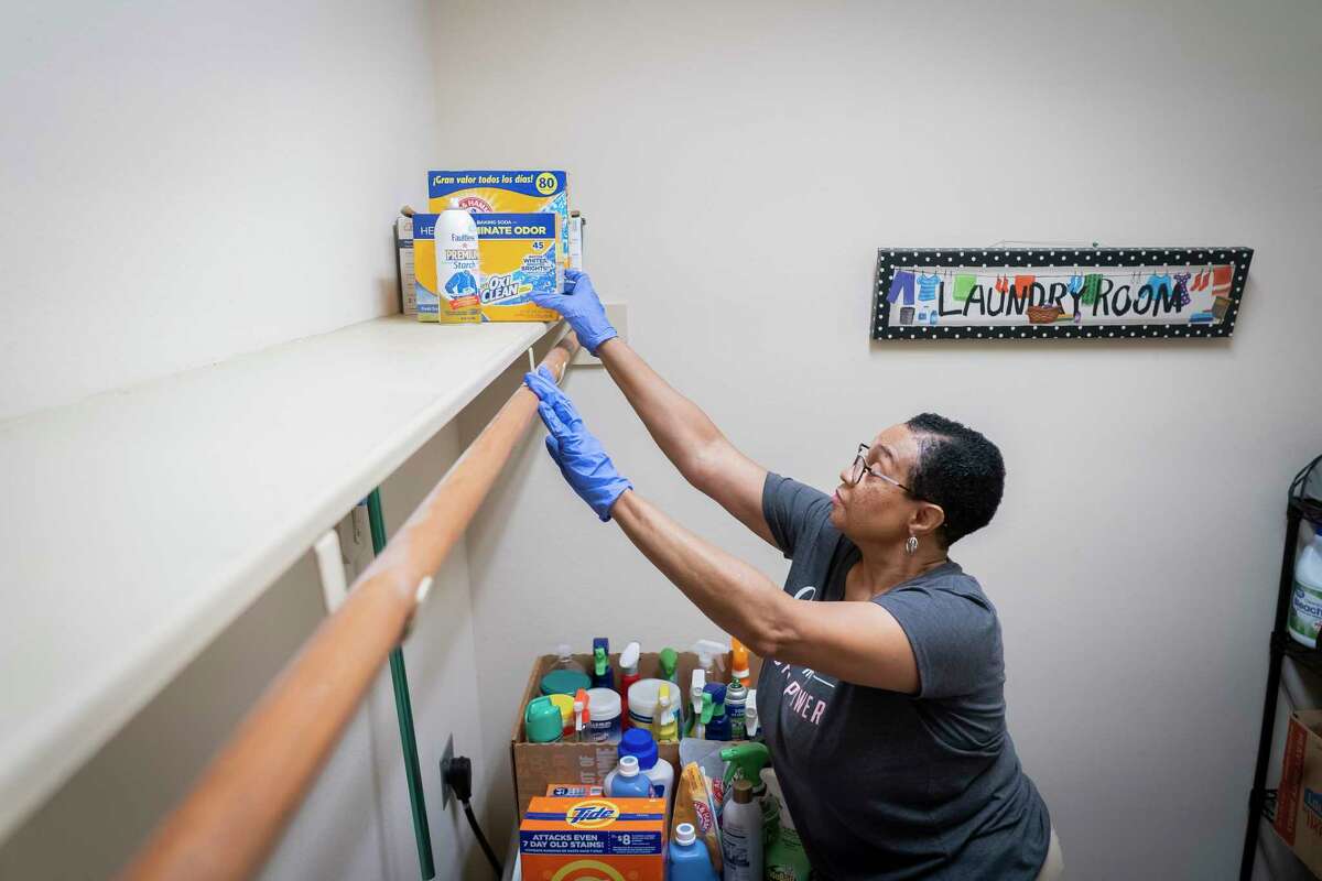 Regina Knox organizes a clients laundry room, Saturday, July 17, 2021, in Katy. Knox is one of the 4.4 million people who started a small business last year during the pandemic, a 24% increase from 2019.