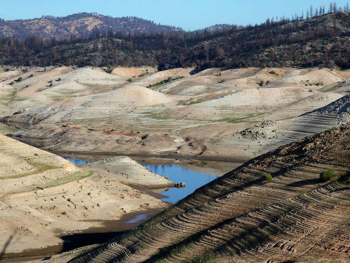 Low water levels are visible at Lake Oroville on July 22, 2021. The power plant at the lake recently resumed operations after being shut down because of low lake levels.