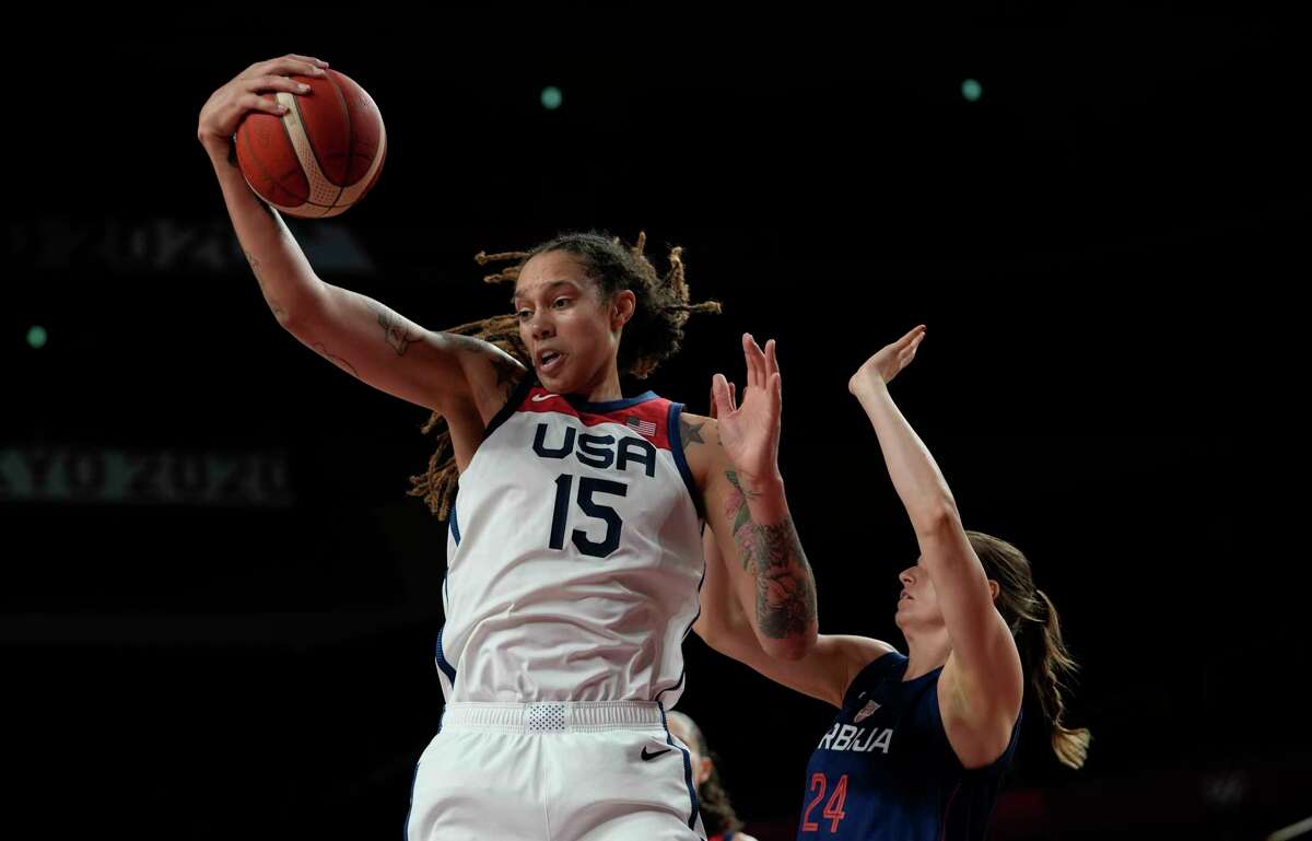 United States' Brittney Griner (15) grabs a rebound ahead of Serbia's Maja Skoric (24) during women's basketball semifinal game at the 2020 Summer Olympics, Friday, Aug. 6, 2021, in Saitama, Japan. (AP Photo/Eric Gay)