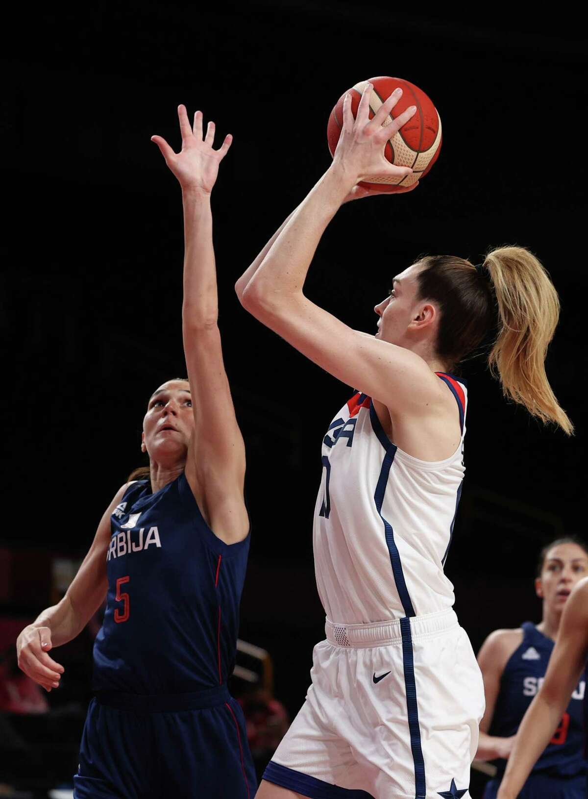 SAITAMA, JAPAN - AUGUST 06: Breanna Stewart #10 of Team United States shoots against Sonja Vasic #5 of Team Serbia during the second half of a Women's Basketball Semifinals game on day fourteen of the Tokyo 2020 Olympic Games at Saitama Super Arena on August 06, 2021 in Saitama, Japan. (Photo by Kevin C. Cox/Getty Images)