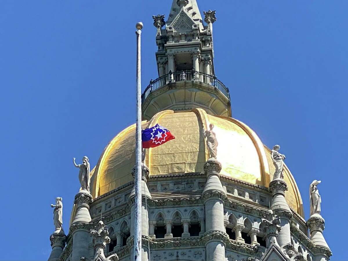 A June 2021 file photo of the Connecticut State Capitol indicates some of the wind-driven erosion to the gold leaf that covers the dome.
