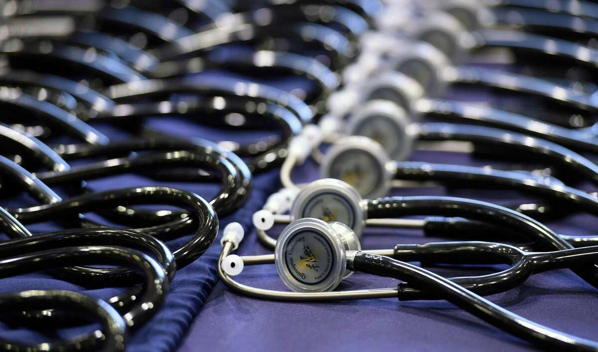 Stethoscopes await members of the class of 2025 during the White Coat Ceremony at Quinnipiac University's People's United Center in Hamden Aug. 5, 2021.