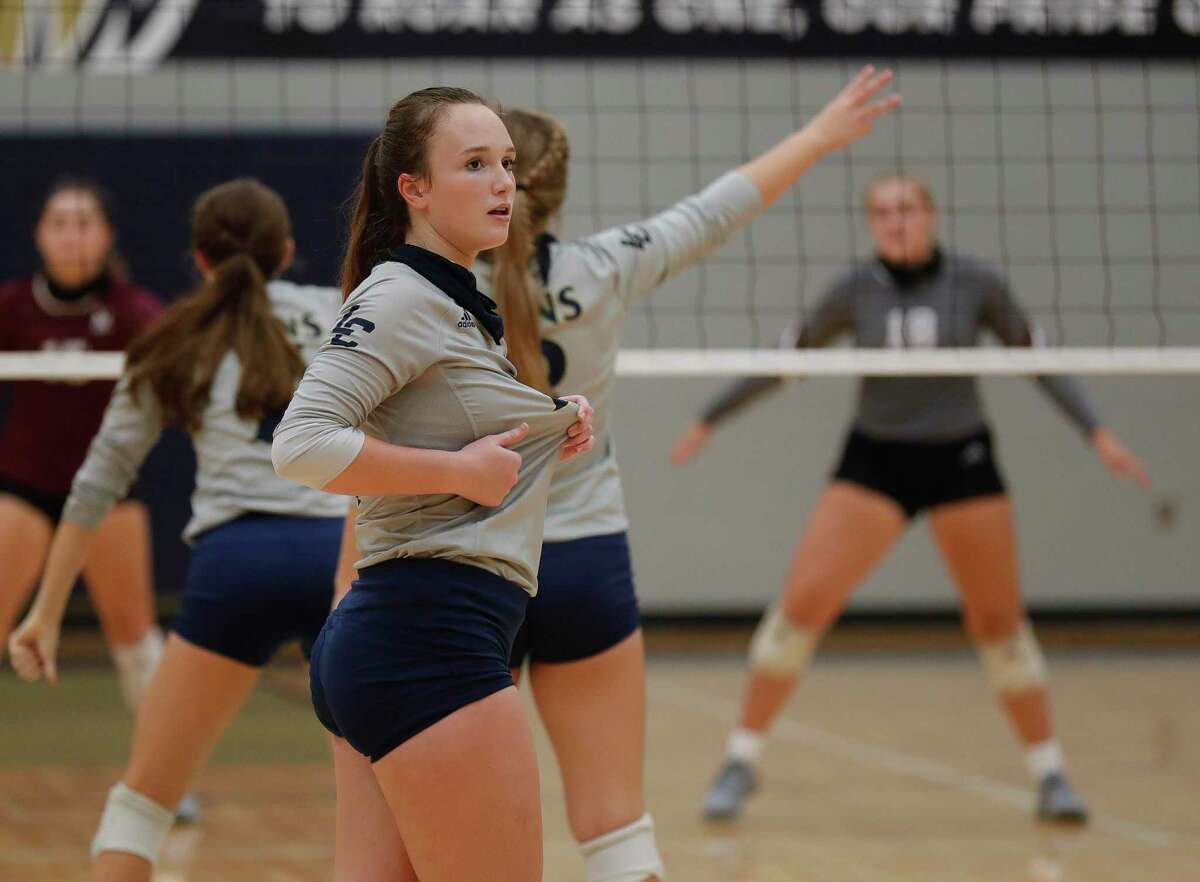Lake Creek setter Lauren Greene (10) signals a set during the third set of a non-district high school volleyball match at Lake Creek High School, Tuesday, Sept. 15, 2020, in Montgomery.