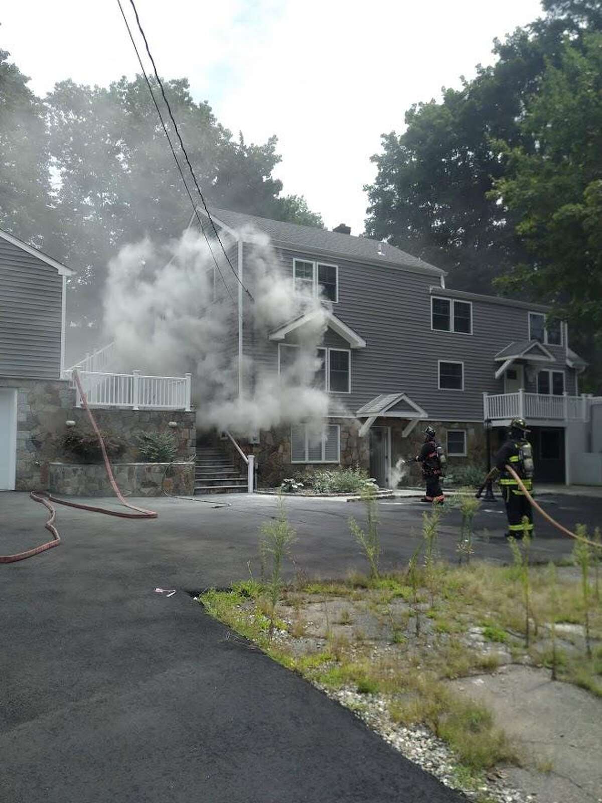 The outside of a Westport home caught on fire Wednesday afternoon.