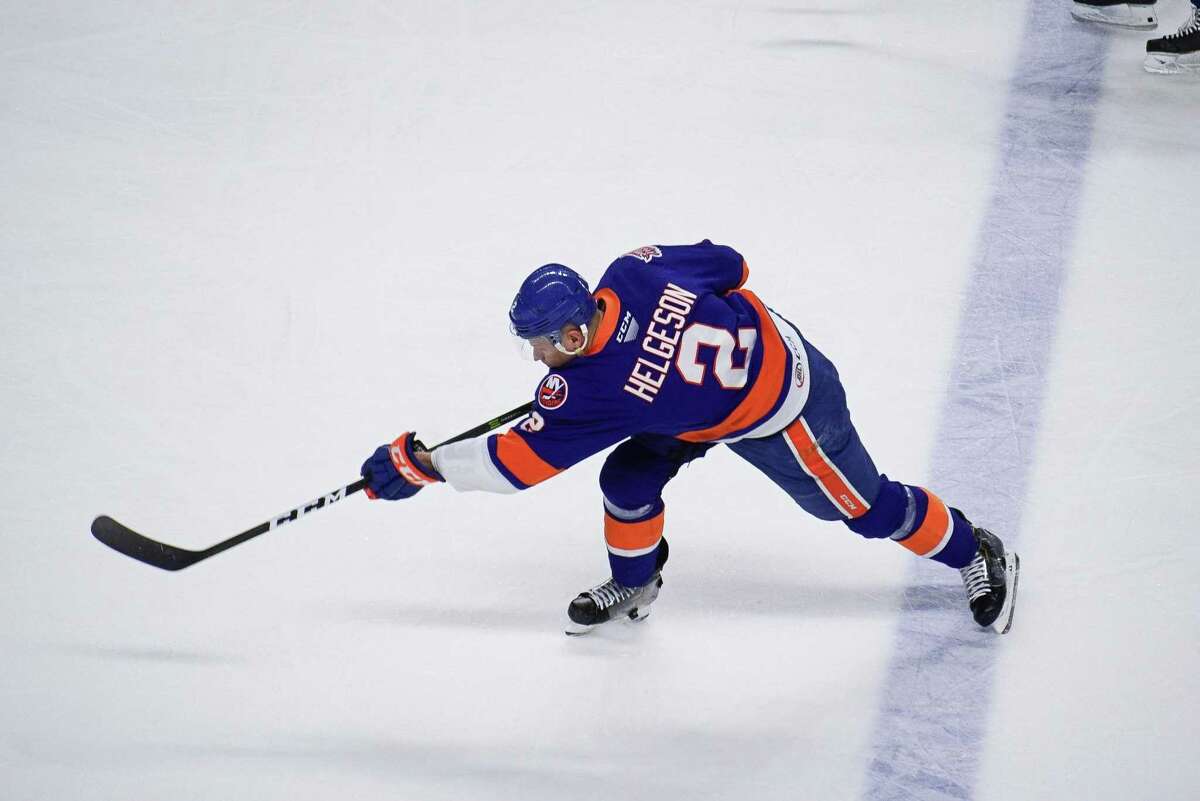 Bridgeport Sound Tigers' defenseman Seth Helgeson shoots against the Providence Bruins during an AHL hockey game on March 31, 2021 at Webster Bank Arena in Bridgeport, Conn.