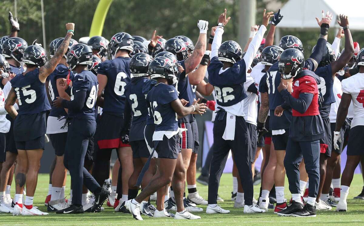 Houston Texans player gather in a huddle to start practice during an NFL training camp football practice Friday, Aug. 6, 2021, in Houston.
