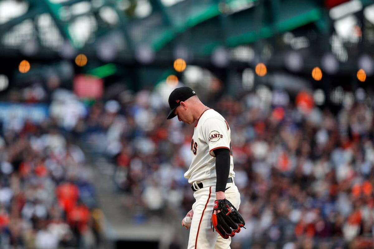 Anthony DeSclafani (26) on the mound in the third inning after giving up 4 runs as the San Francisco Giants played the Los Angeles Dodgers at Oracle Park in San Francisco, Calif., on Wednesday, July 28, 2021.
