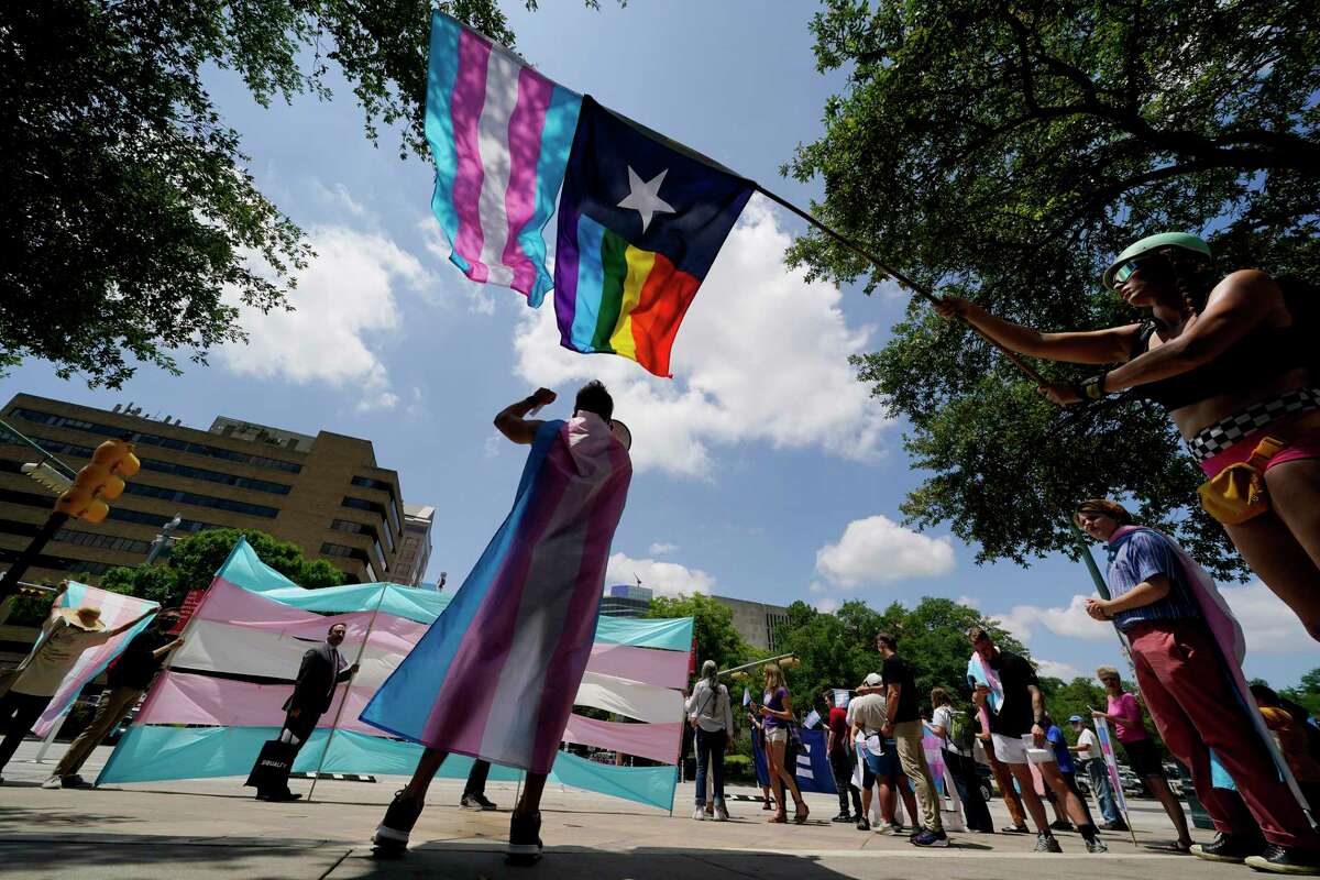 Demonstrators gather on the steps to the State Capitol to speak against anti-transgender bills being considered in the Texas Senate and Texas House in Austin, Texas.