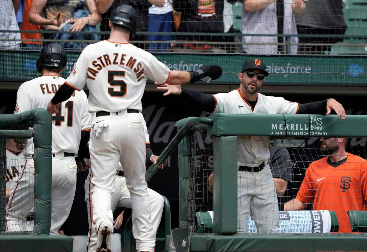 SAN FRANCISCO, CALIFORNIA - JULY 29: Mike Yastrzemski #5 of the San Francisco Giants is congratulated by manager Gabe Kapler #19 after Yastrzemski scored against the Los Angeles Dodgers in the bottom of the first inning at Oracle Park on July 29, 2021 in San Francisco, California. (Photo by Thearon W. Henderson/Getty Images)