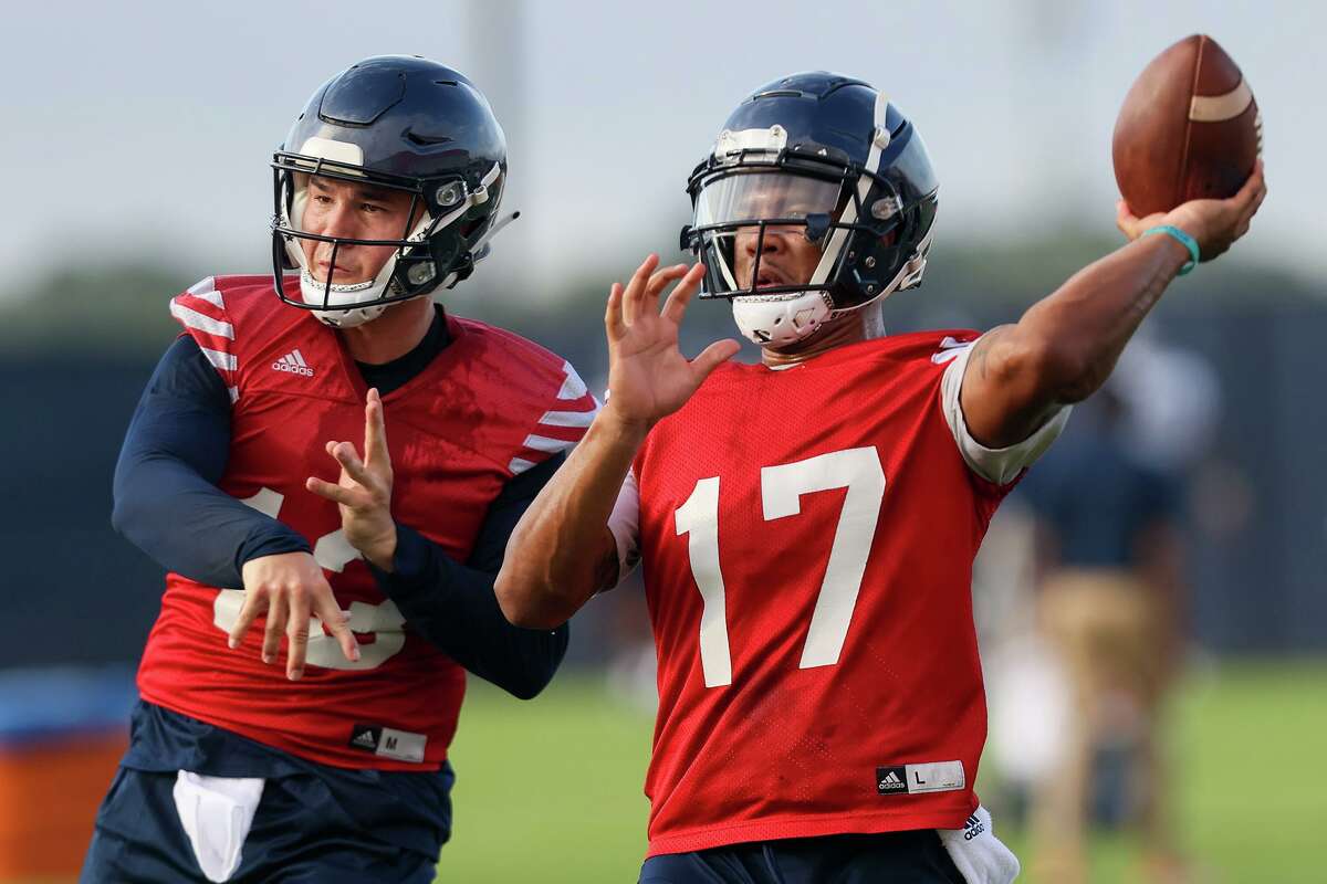UTSA quarterbacks Frank Harris, right, and Josh Adkins work on passing drills during their first football practice of fall camp at the practice fields of the RACE facility on campus on Friday, Aug. 6, 2021.