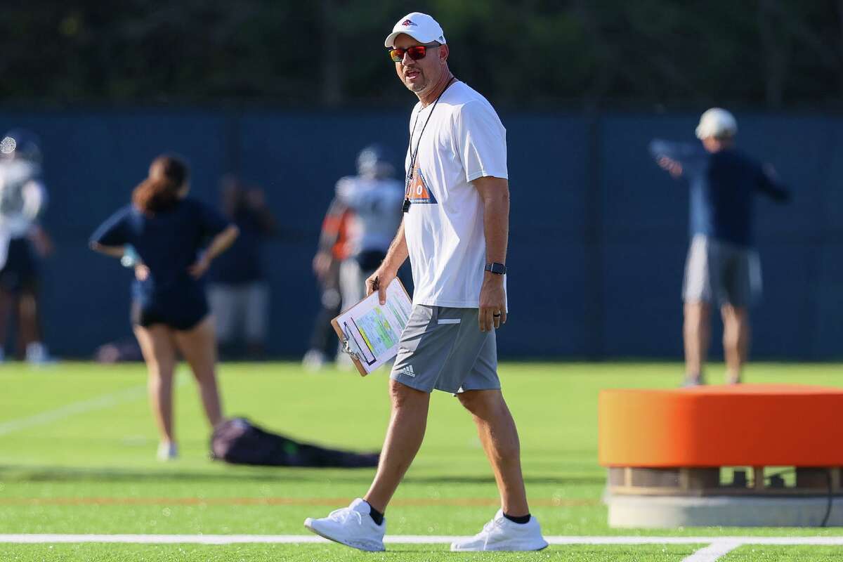 UTSA head coach Jeff Traylor walks between groups during their first football practice of fall camp at the practice fields of the RACE facility on campus on Friday, Aug. 6, 2021.