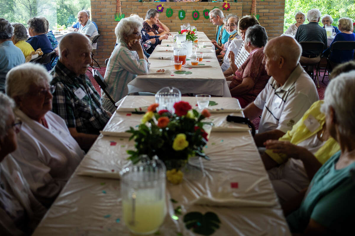 Residents of Riverside Place Senior Living Community celebrate the anniversary of their return to the building with a catered meal Saturday, Aug. 7, 2021 in Midland. (Katy Kildee/kkildee@mdn.net)