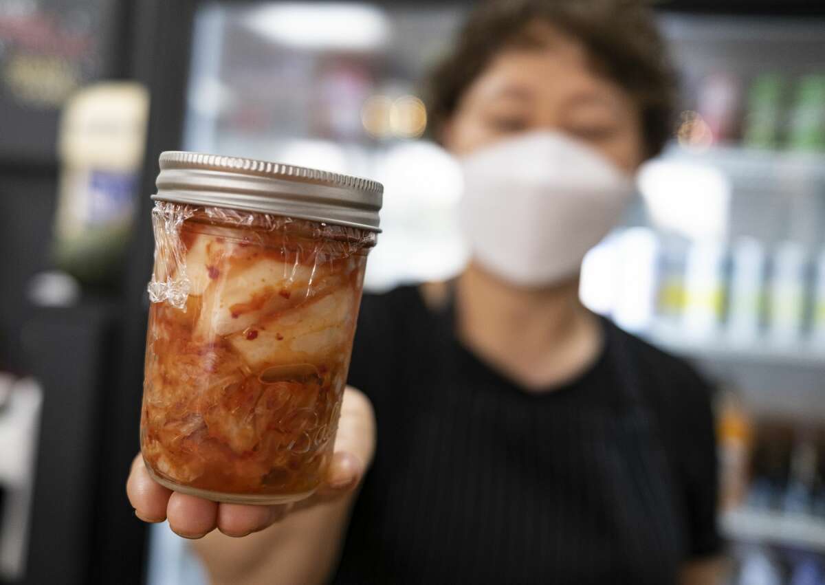 Jong Ran Park hold kimchi for sale at Frymazing.