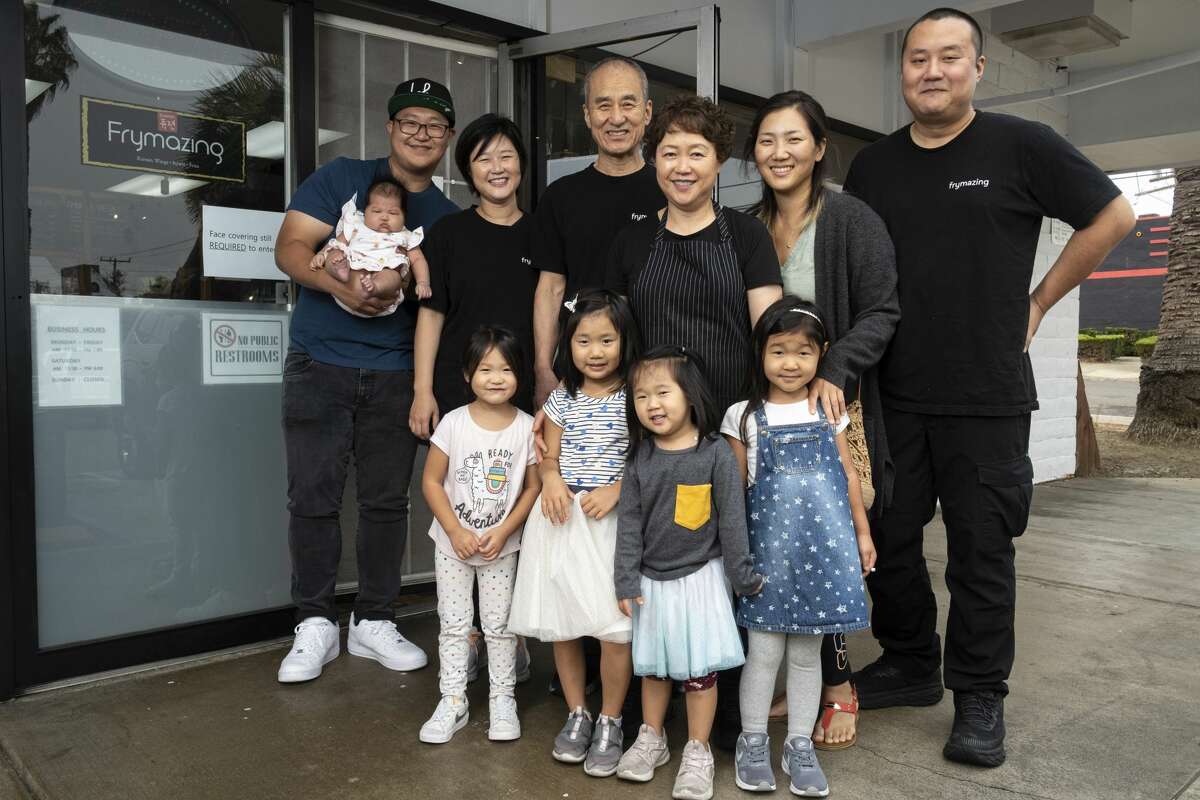 Husband and wife owners Yuh Il Yoon and Jong Ran Park, center, and their family at Frymazing in Vallejo.