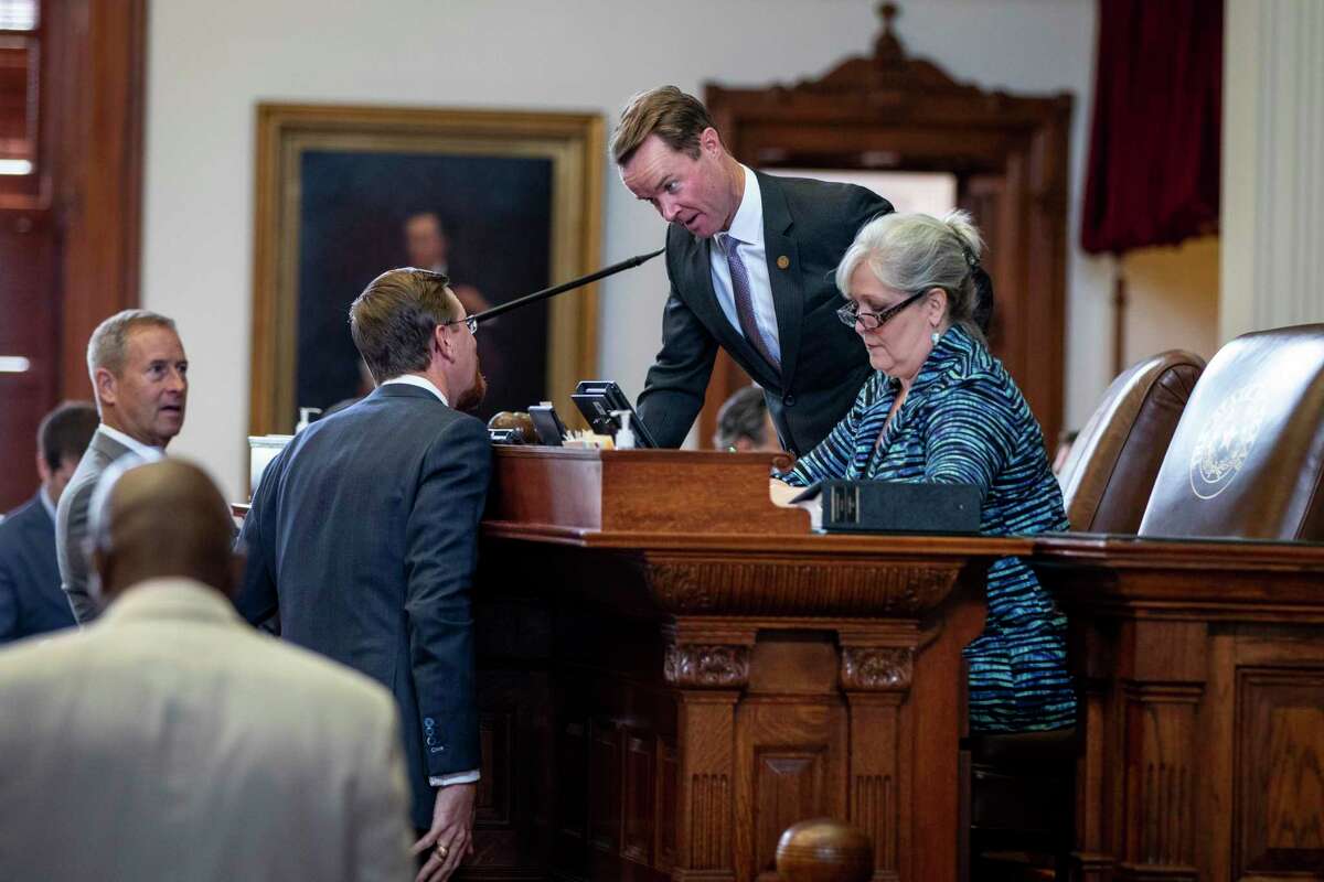 The Texas Speaker of the House of Representatives Dade Phelan speaks to other legislators after quickly adjourning the first day of the second special session called by Governor Greg Abbott on Saturday, August 7, 2021 in Austin, Tx., U.S. The Texas House of Representatives did not have a quorum due to a number of Texas House Democrats being absent and adjourned quickly after opening the session on Saturday afternoon.
