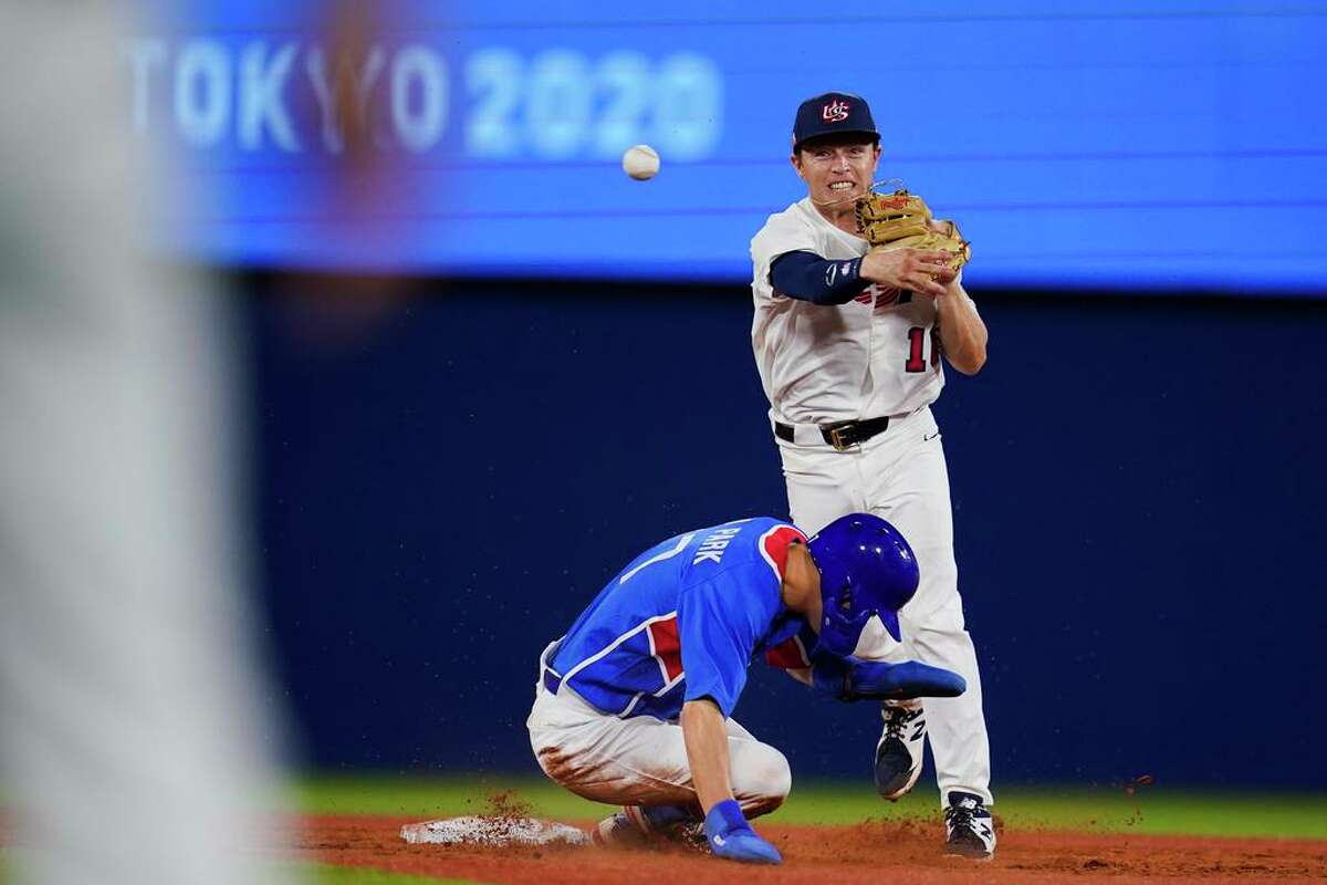 United States' Nick Allen throws to first after forcing out South Korea's Hae Min Park during a semi-final baseball game at the 2020 Summer Olympics, Thursday, Aug. 5, 2021, in Yokohama, Japan. (AP Photo/Sue Ogrocki)